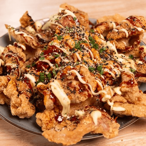 Chicken Skin Nachos — Crispy chicken skin, cheese, salsa.
